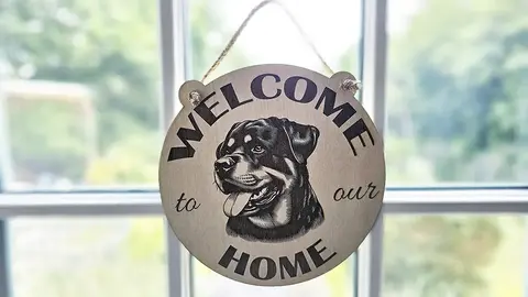 Welcome to our home with a Rottweiler plaque / sign