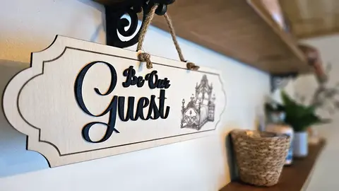 Be Our Guest Sign Deluxe Decorative Plaque With 3D Raised Lettering and Bed Graphic
